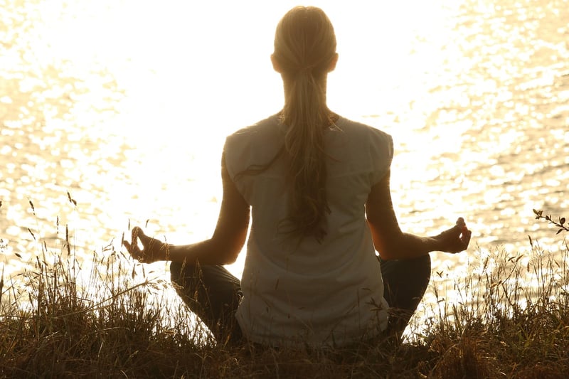 Woman meditating in yoga pose